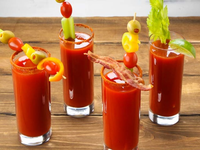 Four glasses of Bloody Mary Drinks