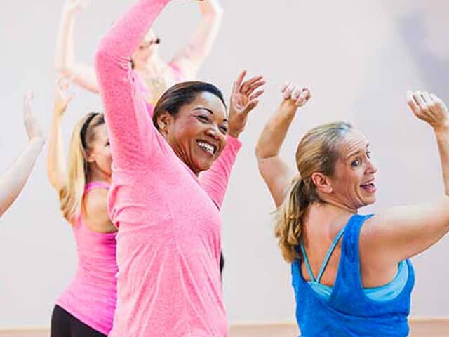 ladies dancing in a group