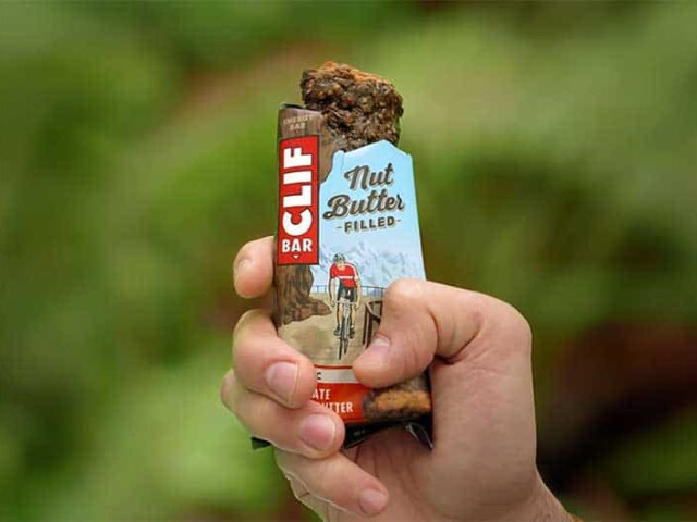 hand holiding CLIF® nut butter filled energy bar