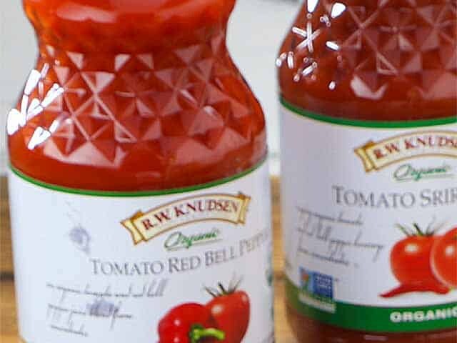 Two bottles of R.W. Knudsen tomato juice