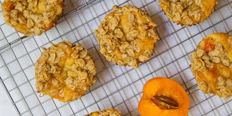 apricot oatmeal muffins on a cooling rack