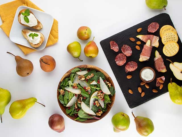 Variety of seasonal pears on plates