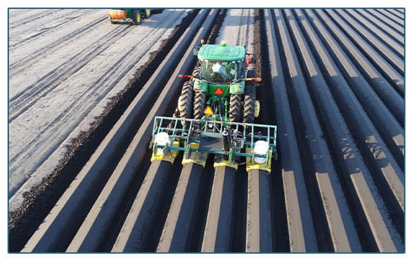 tractor plowing a field.