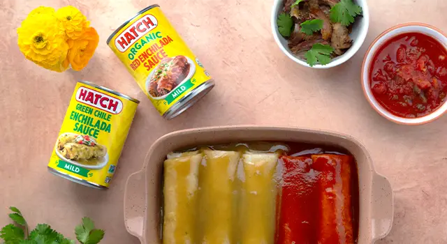 Hatch Organic enchilada Sauce next to a dish of enchiladas.