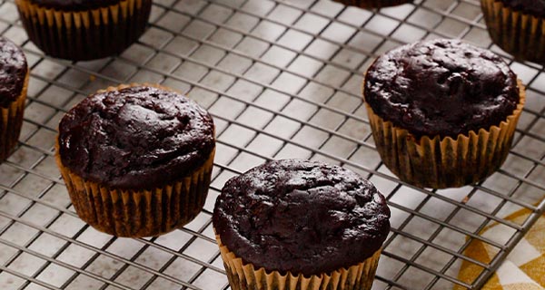 Chocolate Zucchini Muffins on a cooling rack