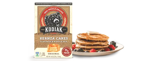 Kodiak Kernza Pancake and waffle mix next to a stack of pancakes