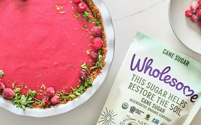 Wholesome Cranberry Pie next to a dish of Cranberries.