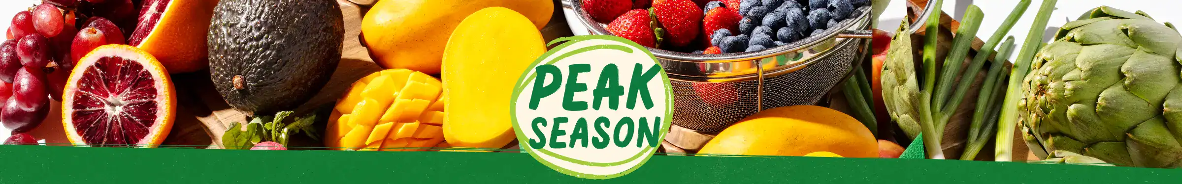 Peak Season produce logo surrounded by fruits and vegetables.